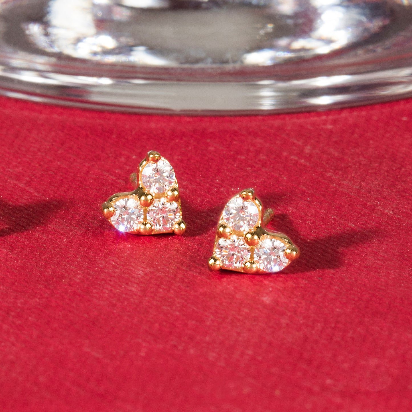 TRIPLE STONE HEART DIAMOND STUDS