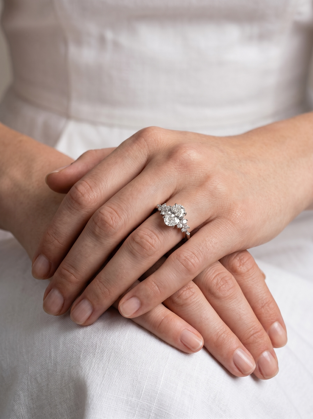 The Aurora Oval Cluster Solitaire ring