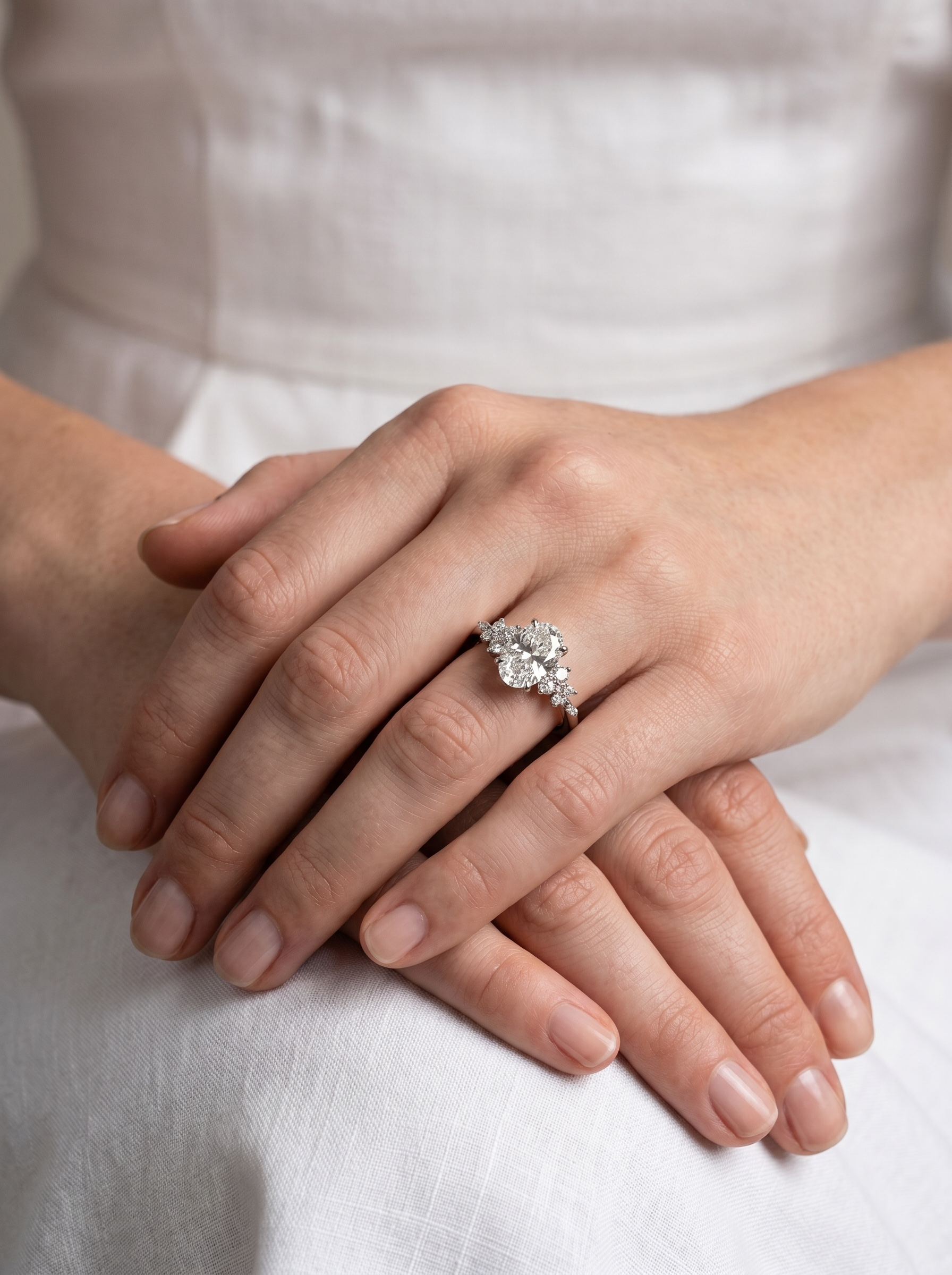The Aurora Oval Cluster Solitaire ring